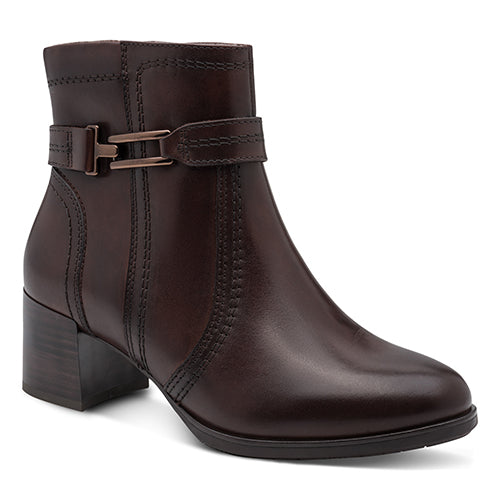 Brown leather ankle boot with a buckle on a white background