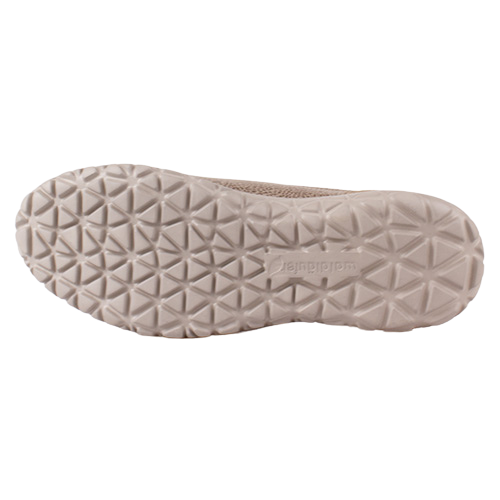 The outsole of a light beige slip-on shoe, showing a textured geometric tread pattern on a plain background
