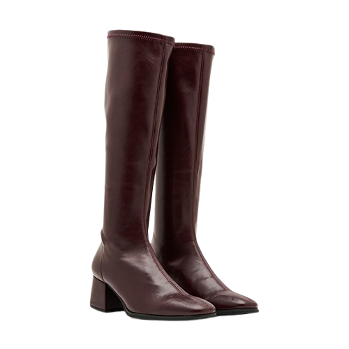 pair of burgundy knee high boots on a white background