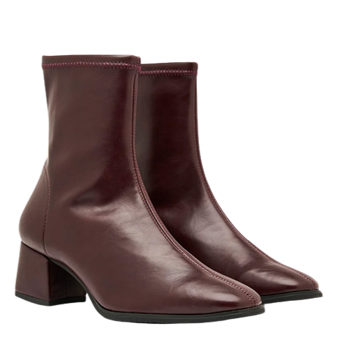 pair of burgundy ankle boots on a white background