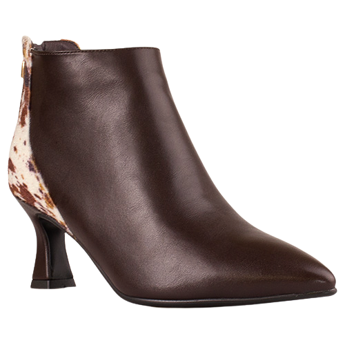 A dark brown leather ankle boot with a pointed toe and a low block heel, featuring a brown and white cow-print patterned insole visible on the side.