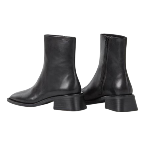 Pair of black leather ankle boots on a white background
