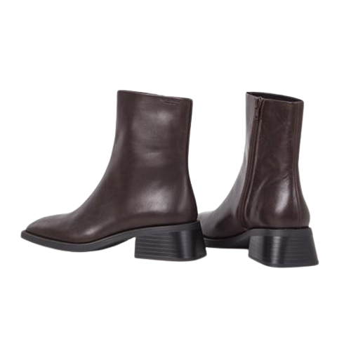 Pair of brown leather ankle boots on a white background