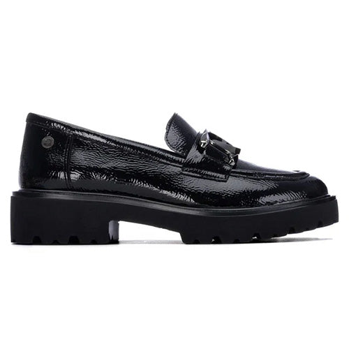 A single black patent leather loafer with a chunky lug sole and a decorative metal buckle detail on the vamp, shown in a side profile against a white background.