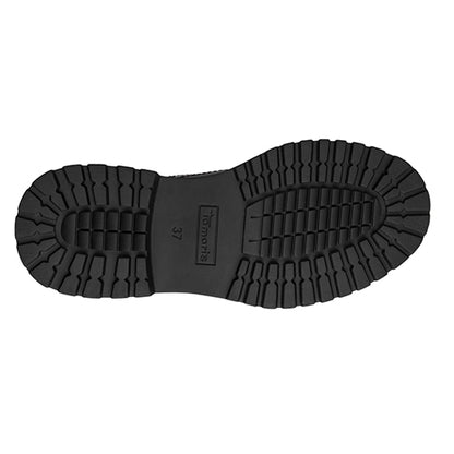 Black rubber sole of a shoe on a white background