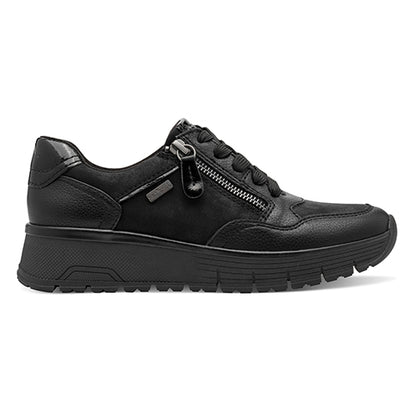 Black shoe with white sole on a light gray background
