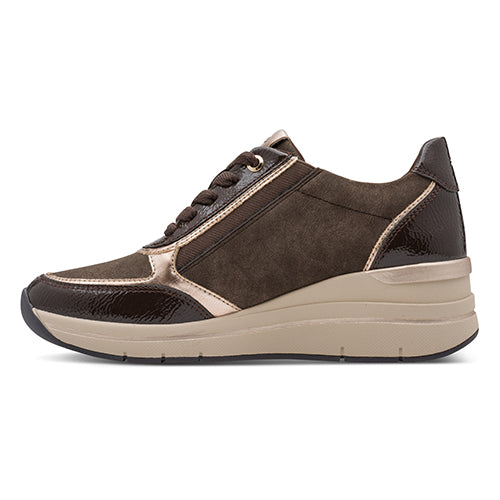 Brown sneaker with beige sole on a white background
