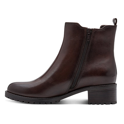 Brown ankle boot with a zipper on a white background