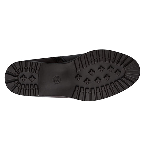 Black shoe sole with tread pattern on a white background