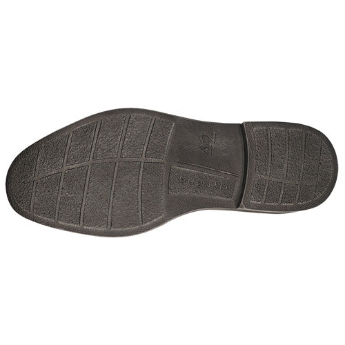 The black rubber outsole of a shoe, showing the tread pattern,  &