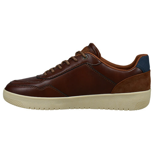 A brown leather low-top casual shoe with a cream-colored sole and a navy blue heel accent, shown in a side profile view against a white background.