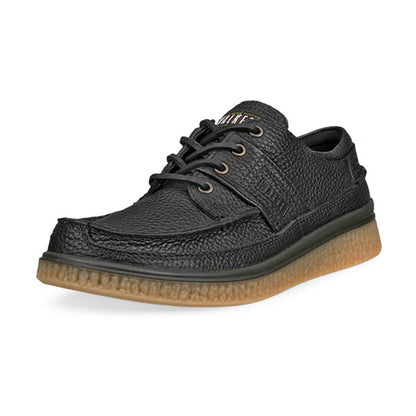 A black textured leather lace-up shoe with a thick, ridged gum sole, shown from a three-quarters angle on a white background.