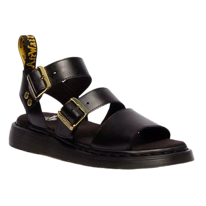 Black sandal with gold buckles on a white background