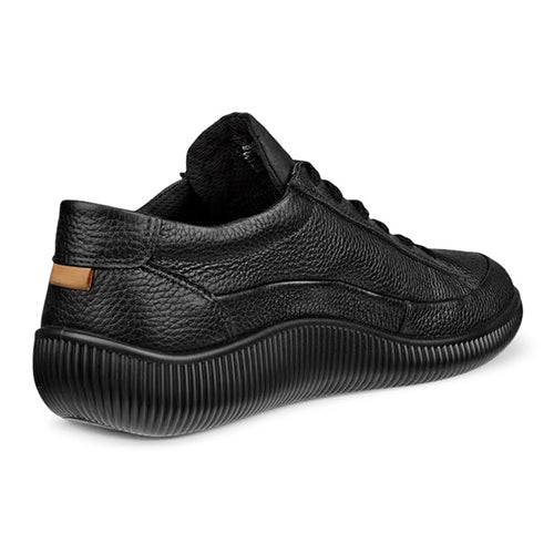 A black textured leather low-top shoes with a thick, ribbed black sole, shown from a three-quarters rear angle on a white background.