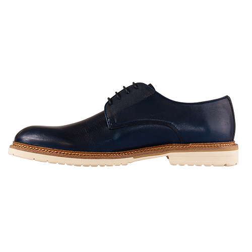 Navy leather shoe with a white sole on a white background