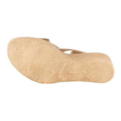 Beige sandal sole with brand logo on a white background