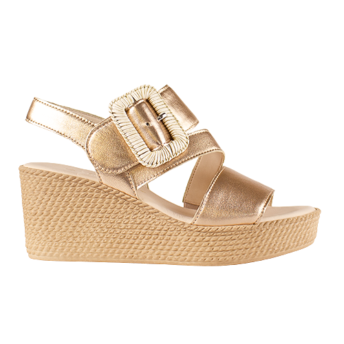 Gold wedge sandal with a buckle on a white background