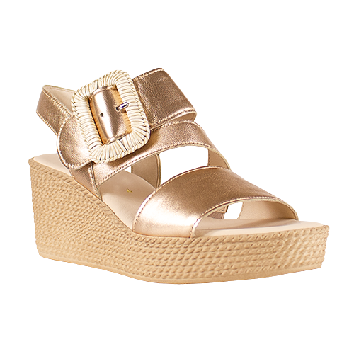 Gold wedge sandal with a strap and buckle on a white background