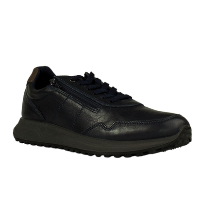 Navy leather trainer with zip on a white background