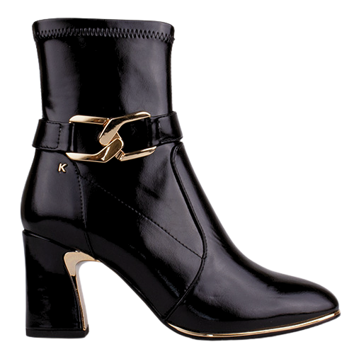 A black patent leather ankle boot with a chunky block heel, a decorative gold-tone buckle strap across the ankle, and a small gold &