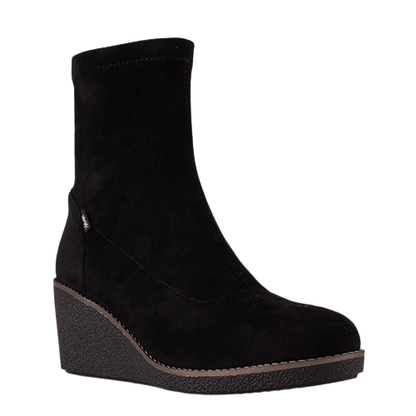 A black suede ankle boot with a wedge heel and a small silver logo on the side, shown against a plain white background.