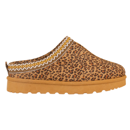 A single slip-on clog shoe with a brown and tan leopard print upper, a zigzag patterned trim in brown and white, and a thick tan sole, shown against a plain white background.