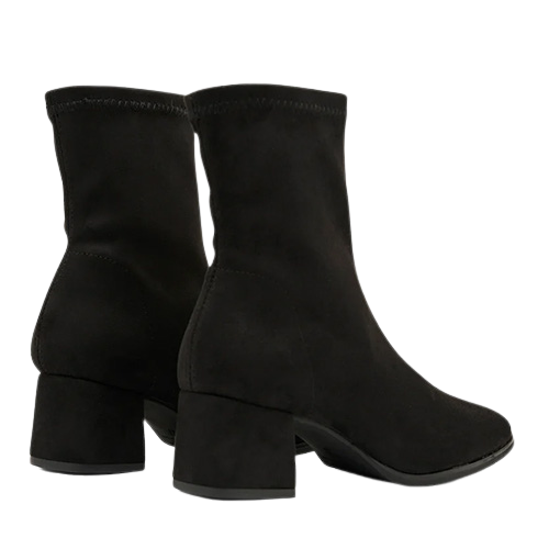 A pair of black suede ankle boots with block heels, shown from a three-quarters angle against a plain white background.