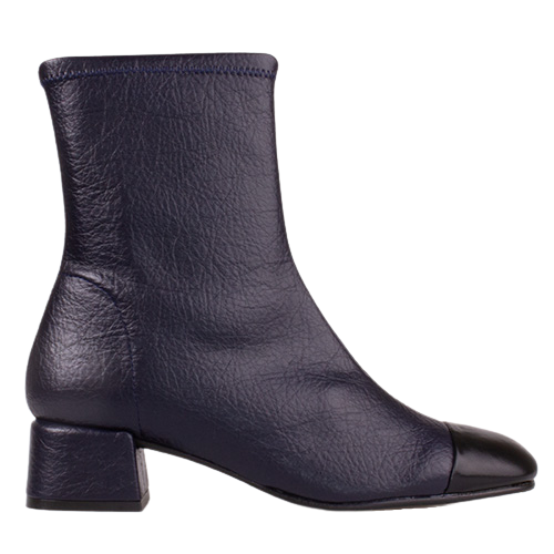 A dark navy blue leather ankle boot with a chunky block heel and a contrasting black cap toe, shown from a side profile on a white background.