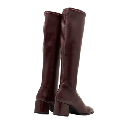 pair of burgundy knee high boots on a white background