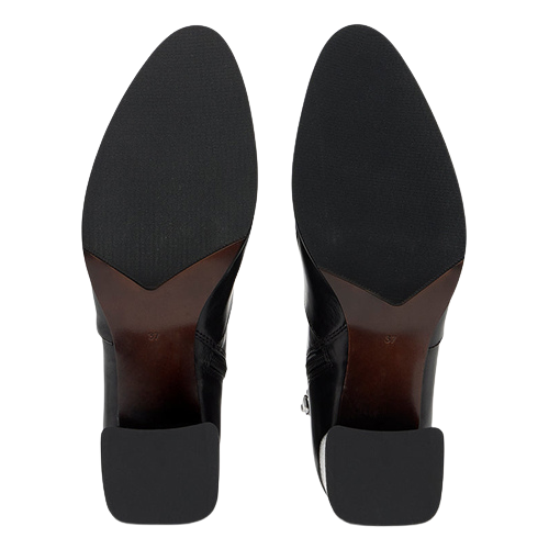 Top-down view of a pair of black pointed-toe boots showing the outsoles and brown heel counters against a white background.