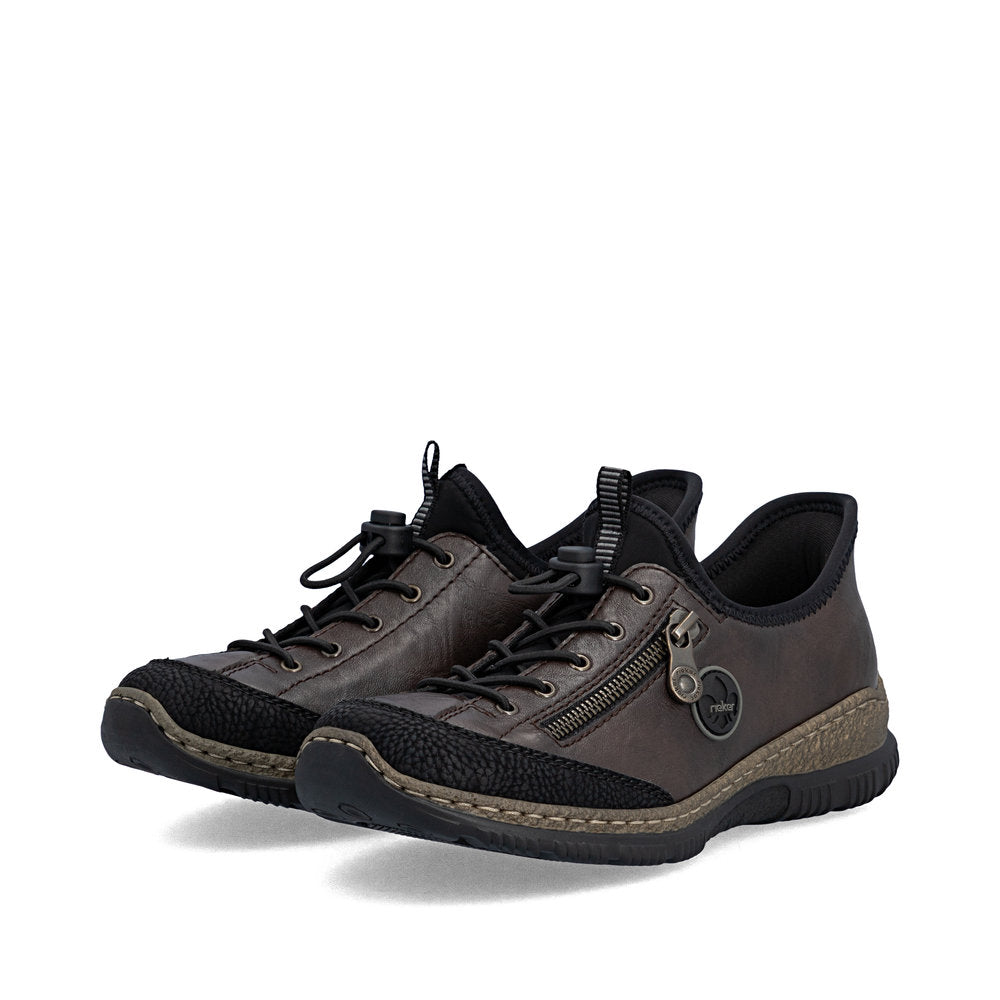 Black Rieker shoes on a white background
