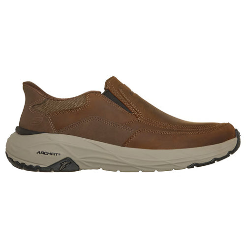 A brown slip-on shoe with a thick beige and black sole, shown from a side profile view on a white background.