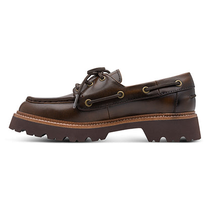Brown leather boat shoe on a white background
