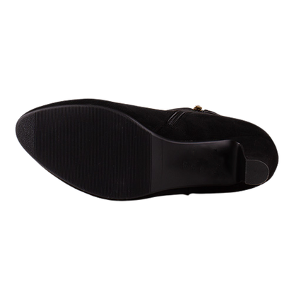 Out sole of Black Suede Ankle Boot on a White Background