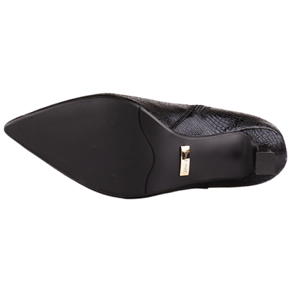 A black pointed-toe shoe shown from the sole view, featuring a textured black upper and a small gold metal brand plaque on the heel.