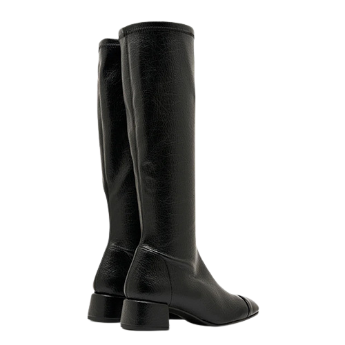 A pair of black knee-high leather boots with a low block heel and pointed toe, shown from a side profile view against a plain white background.