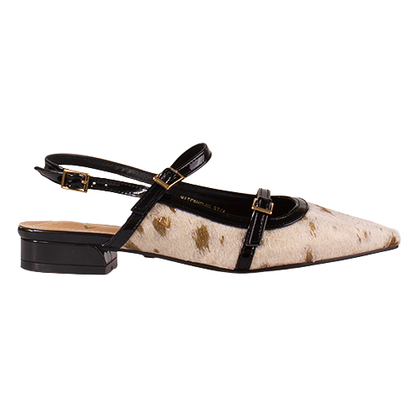 Pointed-toe flat shoe with black strap and gold accents on a white background