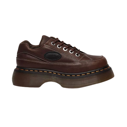 Brown leather shoe with a thick sole on a white background