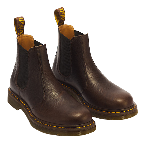 A pair of dark brown leather Chelsea boots with black elastic side panels and signature yellow stitching around the sole, shown on a plain white background.