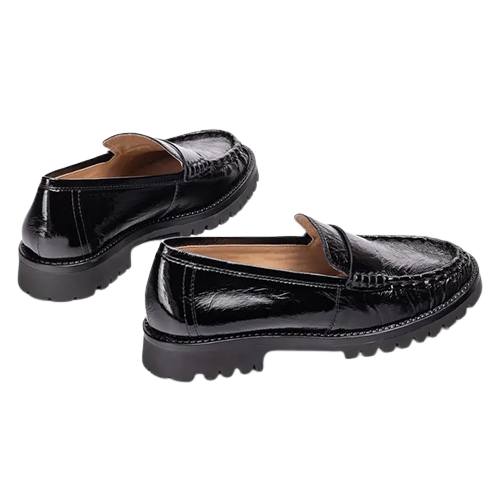 A pair of black patent leather loafers with a crocodile-embossed texture and chunky lug soles, shown on a plain white background.