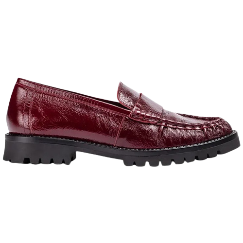 A single burgundy leather loafer with a textured, embossed pattern and a chunky black lug sole, shown in a side profile on a white background.