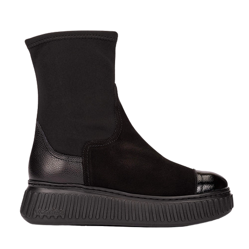 Mixed fabric black boot with a chunky sole on a white background