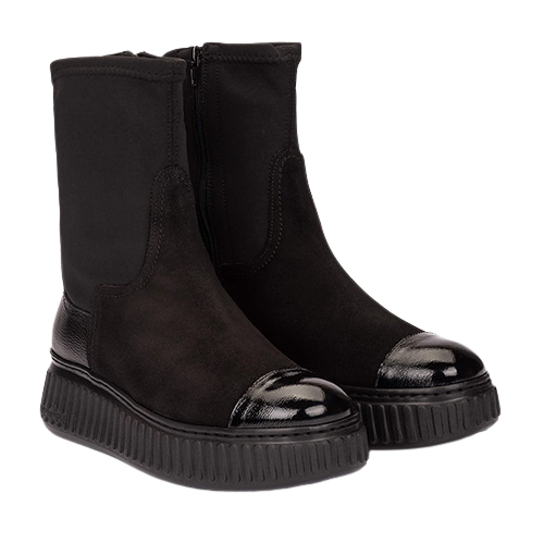 pair of mixed fabric boots with chunky sole on a white background