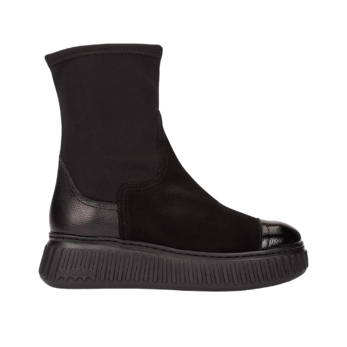 Mixed fabric black boot with a chunky sole on a white background