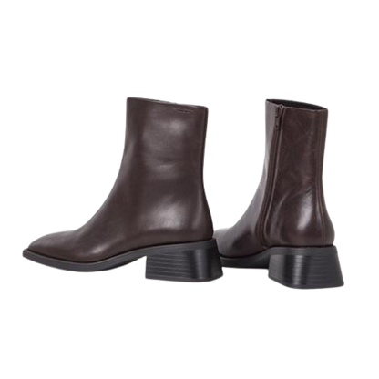 Pair of brown leather ankle boots on a white background