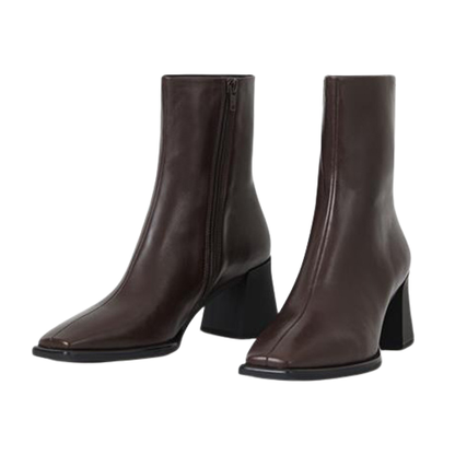 Pair of brown leather ankle boots on a white background