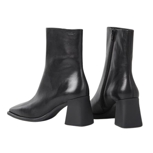 Pair of black leather ankle boots on a white background
