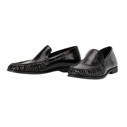 Pair of black loafers on a white background