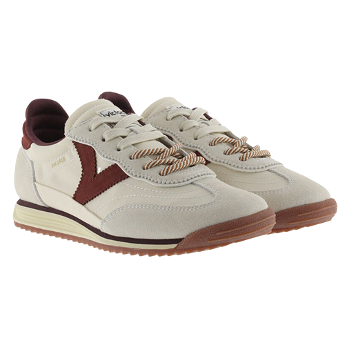 A pair of vintage-style low-top trainers in off-white suede and leather, featuring dark burgundy accents on the side panels, tongue, and heel, with beige-and-brown braided laces and a brown gum sole.