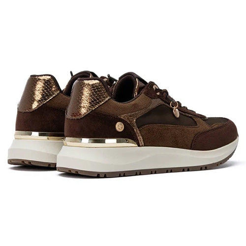 A pair of brown low-top trainers  with metallic bronze textured panels, a white chunky sole with a metallic gold accent band, and a small gold logo on the side, shown against a plain white background.